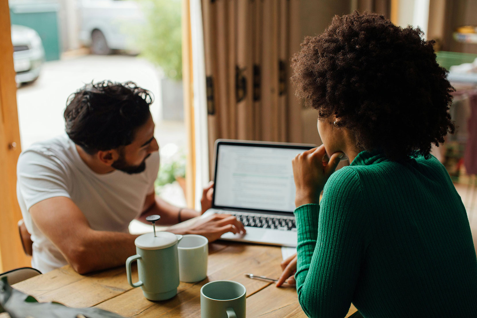 Man and woman looking at computer screen
